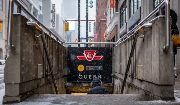 Photo of the underground entrance leading to Queen subway station in Toronto.